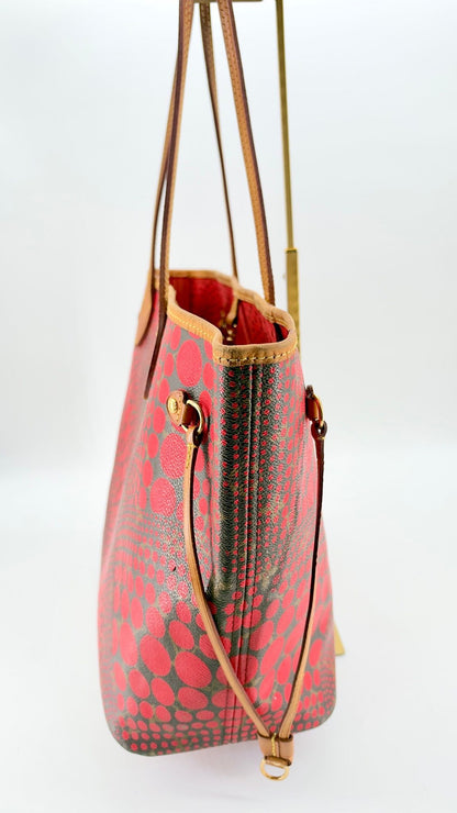 Kusama Neverfull MM side profile with vachetta cinch strap