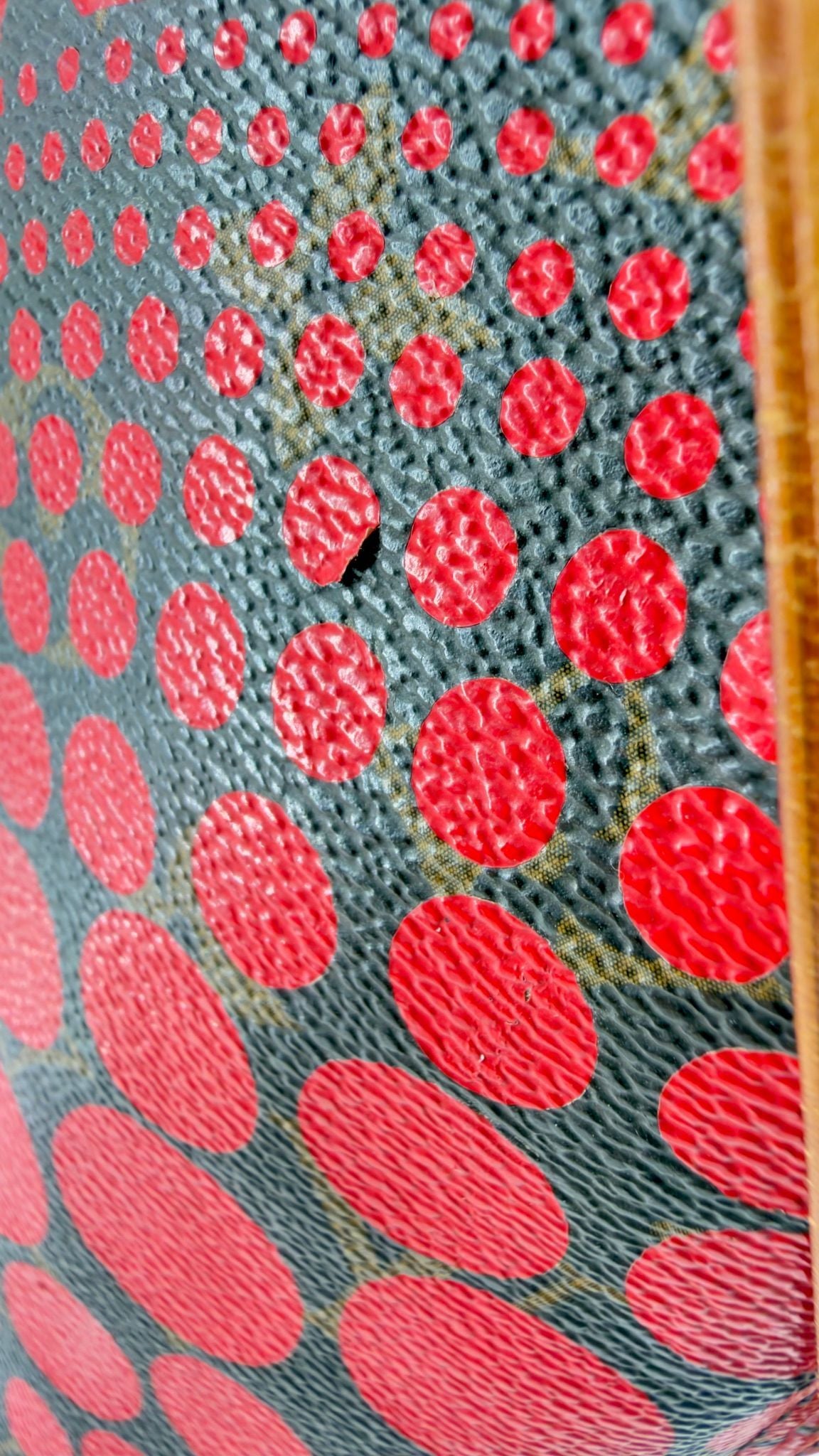 Kusama Neverfull canvas close-up, red dots over Monogram