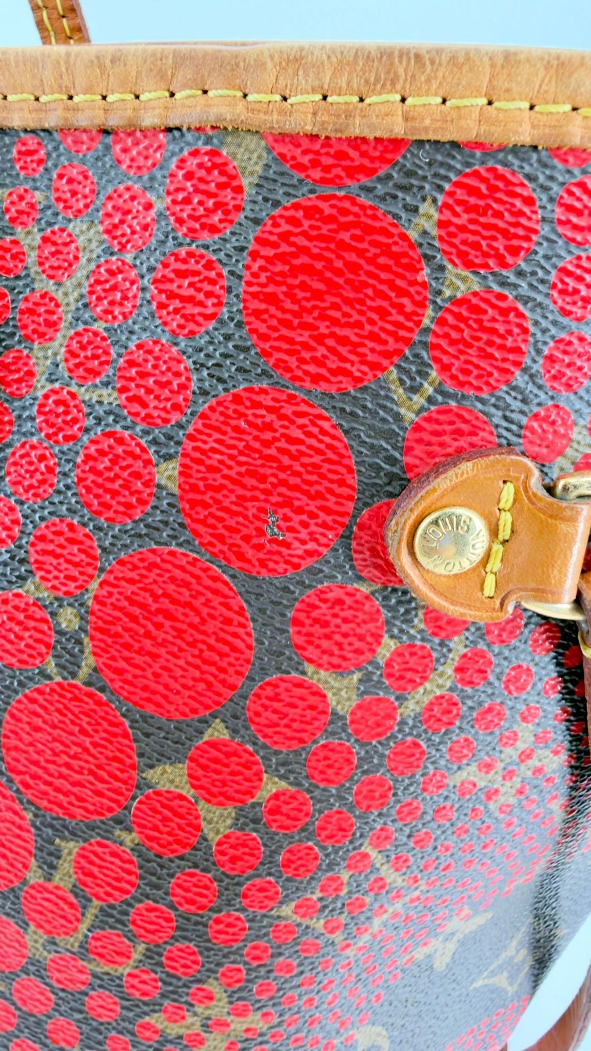 Kusama Neverfull front canvas and top trim close-up