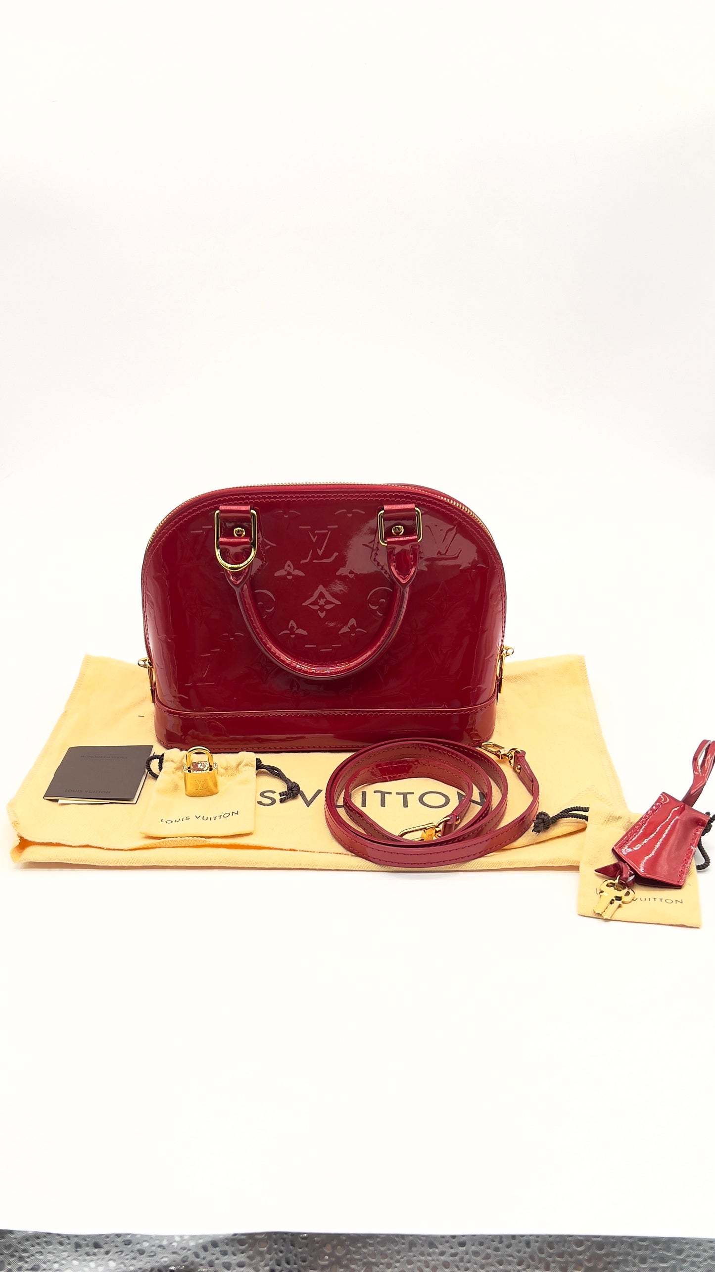 Pre-Owned Louis Vuitton Alma BB in Red Vernis Leather with Strap, Dust Bags Lock, and Keys