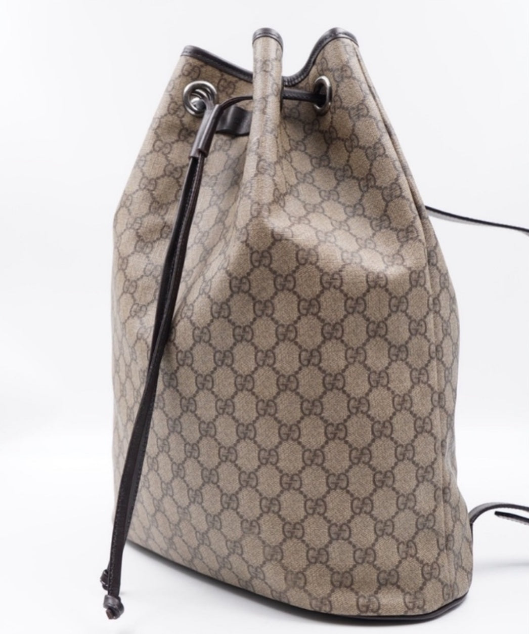 Pre-Loved GUCCI GG Canvas Drawstring Backpack with Silver-Tone Hardware and Leather Trim