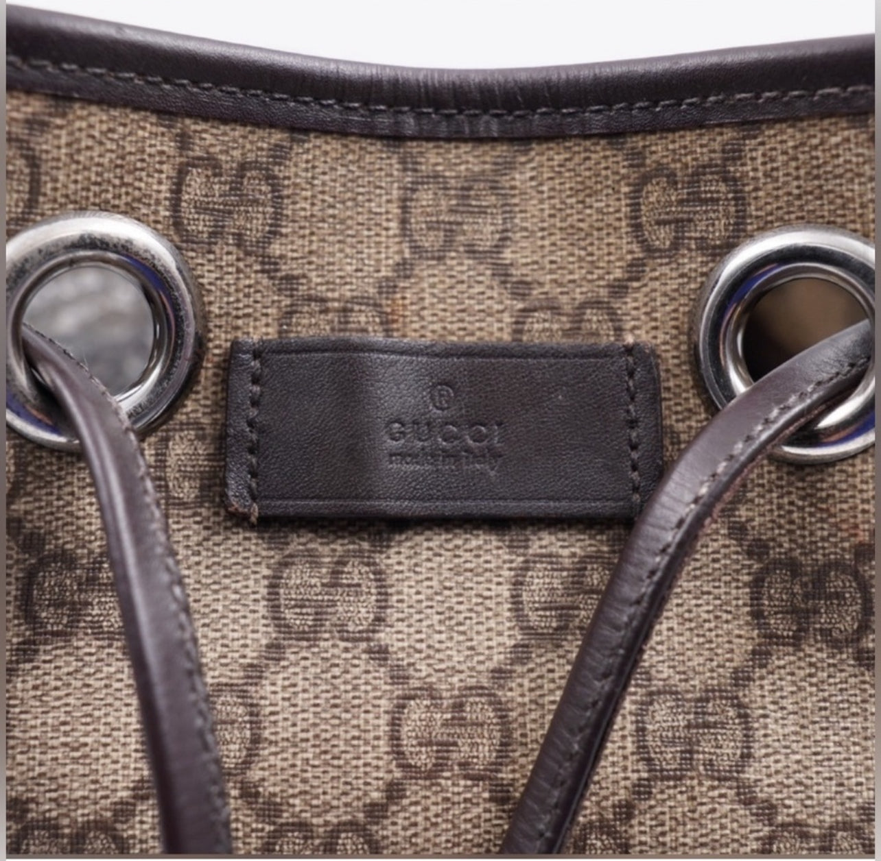 Pre-Loved GUCCI GG Canvas Drawstring Backpack with Silver-Tone Hardware and Leather Trim