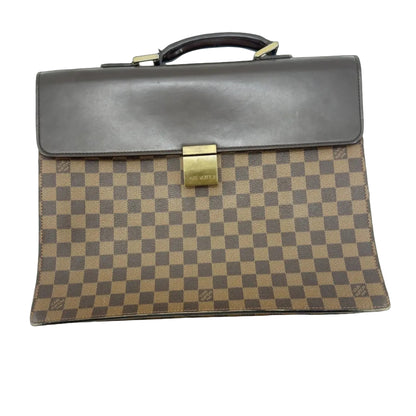Front view of Louis Vuitton Damier Ebene Serviette Conseiller briefcase with brown leather flap trim and engraved brass front clasp