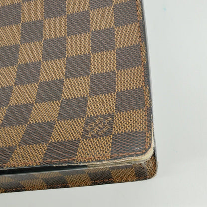 Close-up detail of corner wear on Damier Ebene Serviette Conseiller briefcase